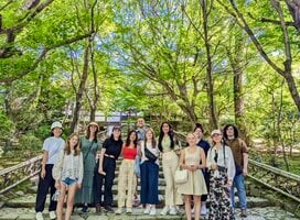 group smiling in the trees